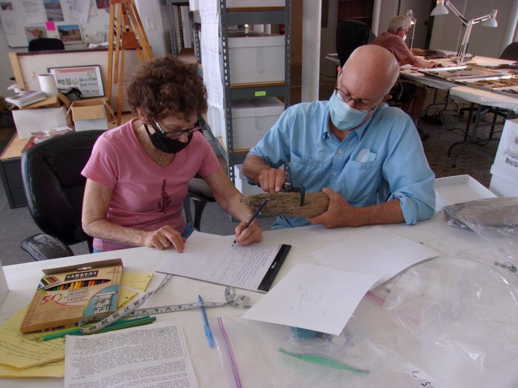 Joyce Clark and Pat Hager analyzing unusual hearth stones from the Layton Field site