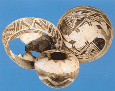Two Classic Mimbres Black-on-white bowls and a Chupadero Black-on-white seed jar. All three were recovered from Ronnie Pueblo, a Reorganization phase hamlet.