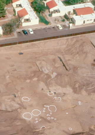 Chalk outlines ancient homes and storage pits before excavation.