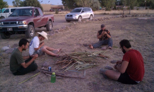 The guys making yucca fiber at dusk. We gathered raw materials near the site and have an ongoing traditional sandal contest.