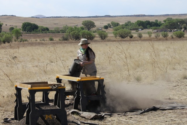 Kelsey Screening Kelsey (Grand Valley State University) screens the dirt from the unit in search of artifacts. Photo by Dan Weinberger.