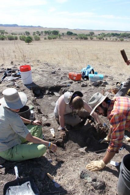 Liz, Zoe, and Jake excavating Liz (Grand Valley State University), Zoe (University of Vermont), and Jake (Hendrix College) work together to excavate part of a room in the southern room block. Photo by Dan Weinberger.