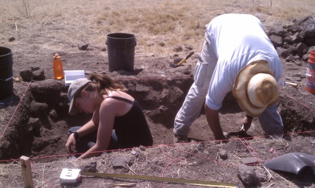 Digging in collapsed masonry allows for some novel stretching opportunities. Henry and H.T. manage to fit into their excavation unit in the north room block of Fornholt.