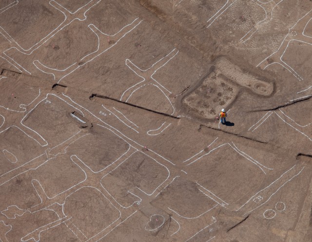 Aerial Photograph of the Early Agricultural Period Site of Las Capas, northwest of Tucson. Canals (outlined in white paint) conveyed water to field plots. Image (c) Henry D. Wallace 2011.
