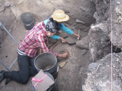 Emily and Megan excavate a posthole and hearth on the upper floor of this room. Click to enlarge.