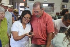 Examining a carbonized corn cob