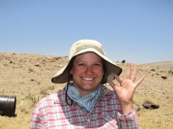 Elizabeth holding a sherd disk