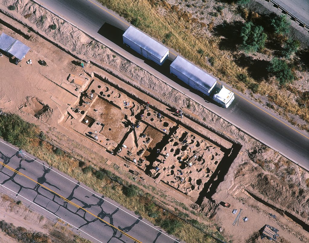 Active Excavation with Passing Tractor-trailer