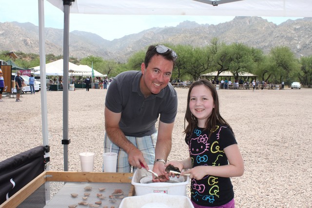 Archaeology Southwest Finance & Policy Committee member Matthew Harrison and his daughter Belle washing 1,000 year-old sherds from the San Pedro River valley.