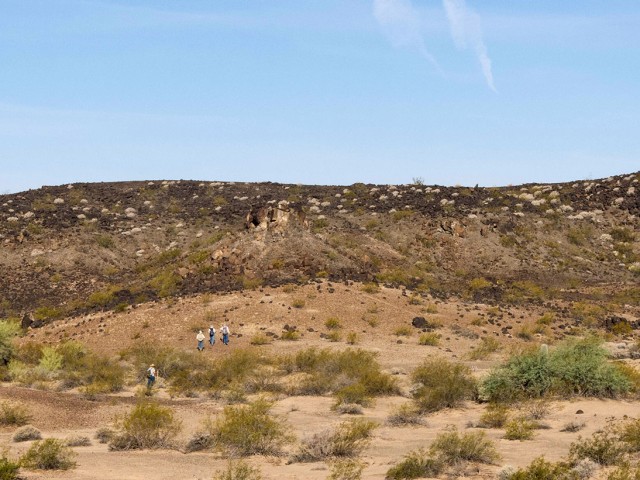 Doug, Brett, Rich and Rob approaching the hillside rock circle or possible sun geoglyph. Click to enlarge.