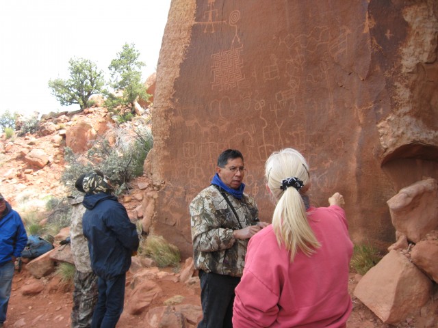 Discussing ancient petroglyphs. Photo by Connie Reid.