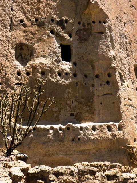 Talus House with a cavate room and post holes that were part of a three-story masonry structure. Click to enlarge.