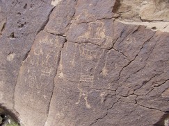 These large petroglyphs resemble the Pilings figurines (see slideshow above), which were found nearby. Photo by Matt Peeples. Click to enlarge.