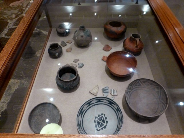 Images of ceramic vessels and other objects recovered from the Pueblo Grande de Nevada site. The cooking jars and black-on-gray bowls may have been produced in the vicinity of the site, but the redware vessels were likely imported from further south and east in the Kayenta region. Collections of the Lost City Museum. Photo by Matt Peeples. Click to enlarge.