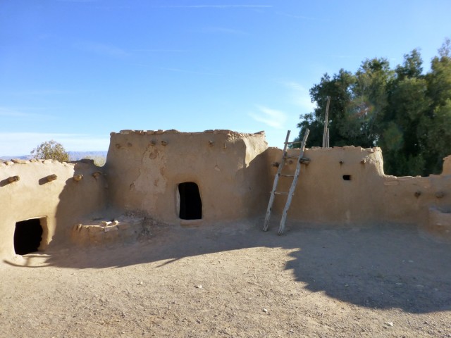 This reconstructed portion of the Pueblo Grande de Nevada site was built by Civilian Conservation Corps in the 1930s directly on top of the original wall foundations. Photo by Matt Peeples. Click to enlarge.