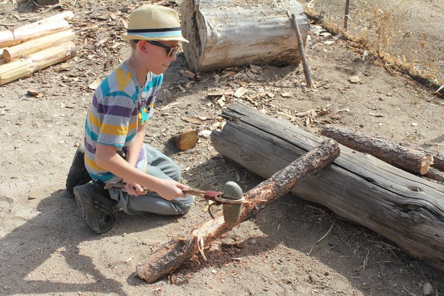 Trying out the axe. Photo by Linda J. Pierce.