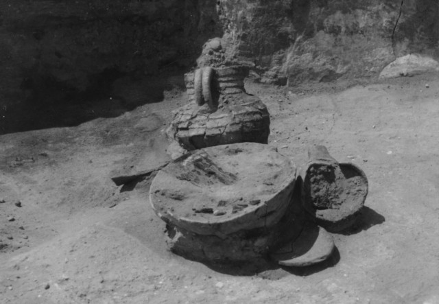 Pueblo I vessels on the house floor. Photo by Paul Reed.