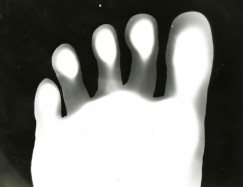 Here’s my creepy footprint. I stepped directly on photo paper, exposed it to light, and developed it. Click to enlarge.