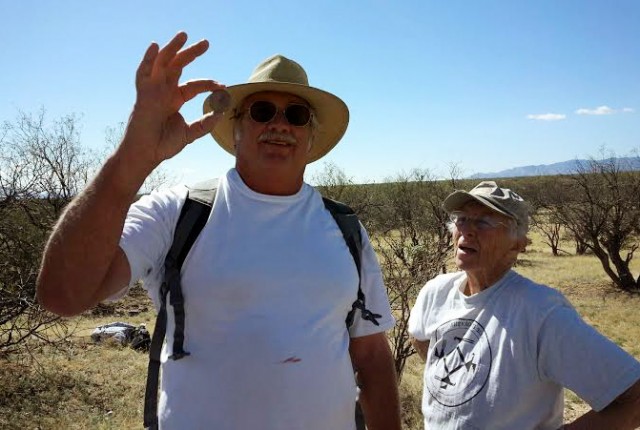 Long-time Archaeology Southwest volunteers Ken and Cherie. Ken is holding a perforated sherd disk that probably served as a spindle whorl, meaning that it was appended to a spindle to maintain and increase spin speed.