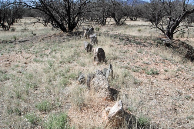 Compound wall “cimientos” used to secure the adobe wall to the ground surface. Photo by Steve Cox. Click to enlarge.