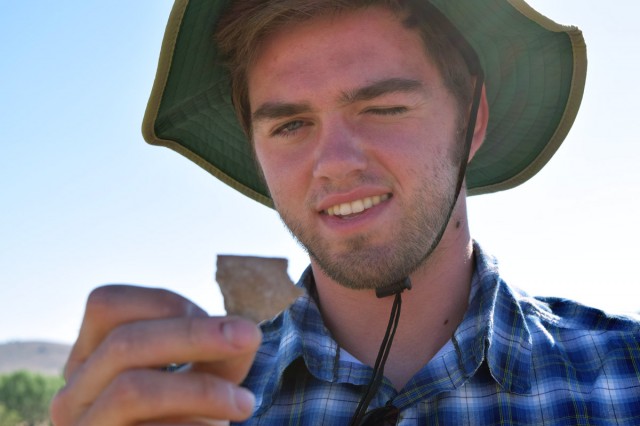 Andrew examines a pottery sherd on our tour of the Valencia site. Photo by Hannah Zanotto.