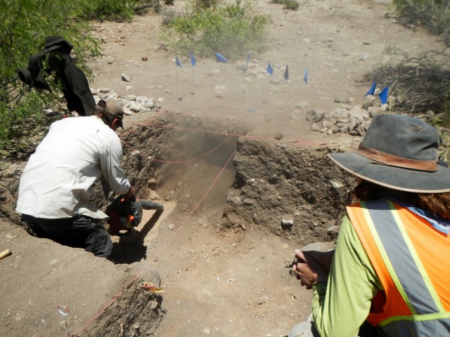 Allen uses the blower to reveal the compacted sand at the bottom of our unit.