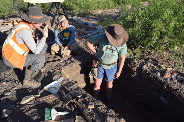 Leslie, Erin, and Karen examine the stratigraphy in an excavation unit to understand the context of artifacts we recovered there. Photo by Hannah Zanotto.