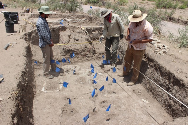 Andrew, Aaron, and Will mapping floor features. Photo by Karen Schollmeyer.