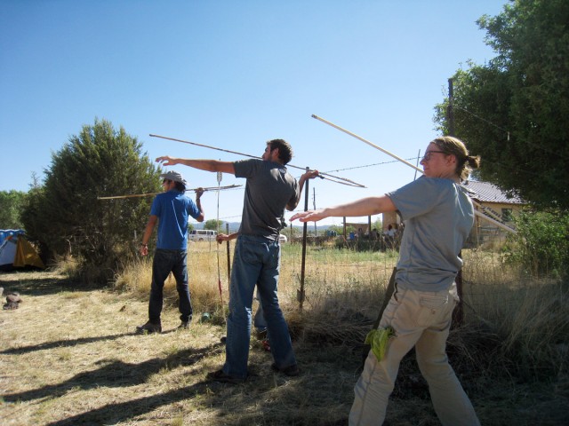 Chris, Riley, and Kaelyn take aim with their atlatl darts. Photo by Allen Denoyer.