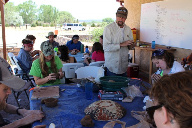 Learning by doing. We explore different uses and types of natural clay and basic pottery-making as part of our experimental archaeology lessons. Ancient technologies expert Allen Denoyer (standing) leads us. Photo by Karen Schollmeyer.