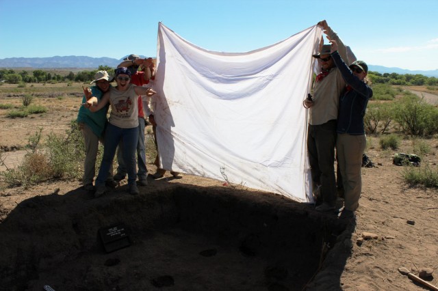 Our crew making shade for photographs of the excavation unit floors. Photo by Karen Schollmeyer.