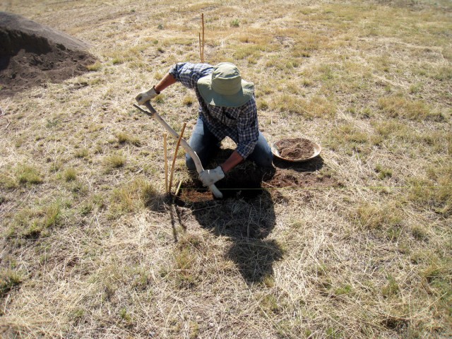 Andrew beginning the digging of the trenches in which the <i>cimientos</i> (foundation stones)will be laid. Photo by Allen Denoyer.