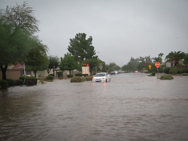 Flooding in Phoenix. Photo courtesy of <a href="https://flic.kr/p/p8orVQ">Devon Christopher Adams.</a>