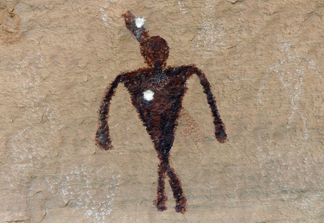 Bullet scars on a Cedar Mesa pictograph. Photo by Bill Doelle.
