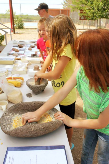 Kids try their hands at some tough work at an outreach event we co-hosted in New Mexico. Photo by Linda J. Pierce.