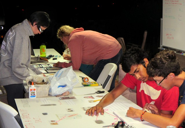 Students put the finishing touches on their projects for the Archaeology Fair.