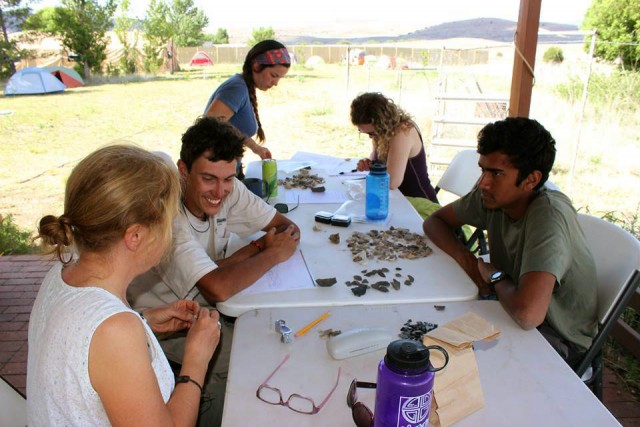 Alec, Monica, Devinne, and Dushyant sorting and recording artifacts. Photo by Karen Schollmeyer.