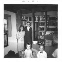 My grandparents’ bookcase, full of treasures awaiting discovery. That’s my aunt and uncle, and me and my brother in front.