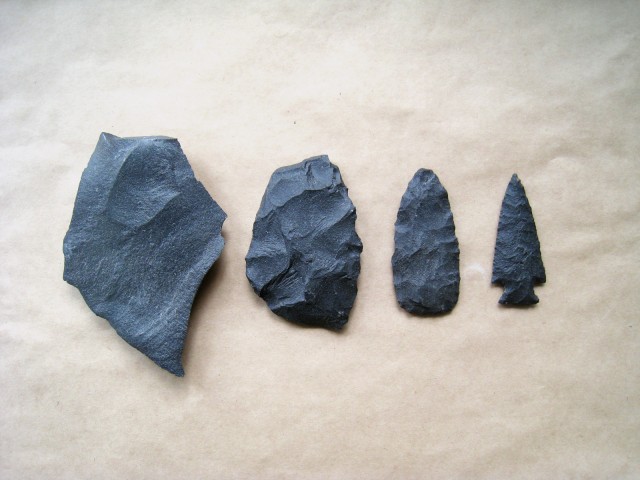 The process of making a projectile point. From left to right: unmodified flake, retouched flake, biface, projectile point.