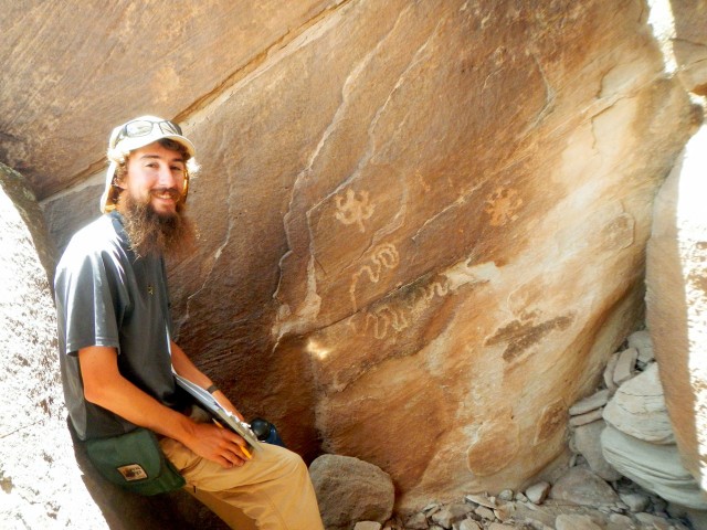 Max recording a rock art panel on the Petrified Forest National Monument, AZ