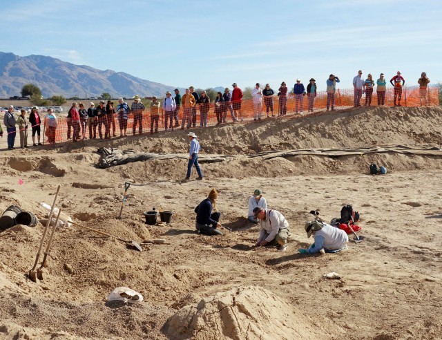 Volunteers in the dirt with SWCA archaeologist Jerome Hesse providing an overview of the site with tour participants.