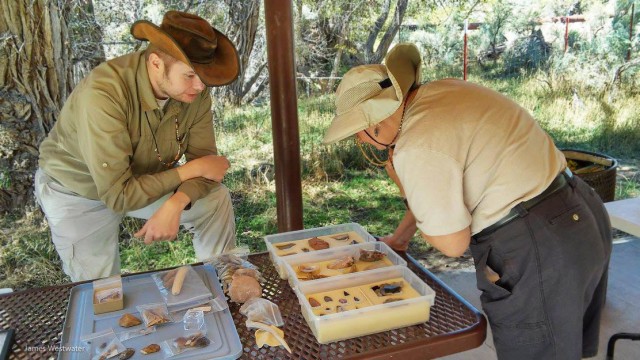 Archaeologist Chris Merritt showcasing an artifact teaching collection at the Cottonwood Glen Picnic Area. Image: Jim Westwater