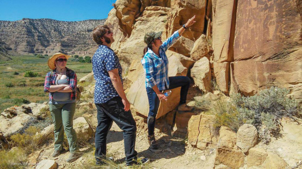 Visitors learning about Archaic and Fremont Period rock art from Archaeologist Jamie Clark Stott. Photo Credit: Jim Westwater