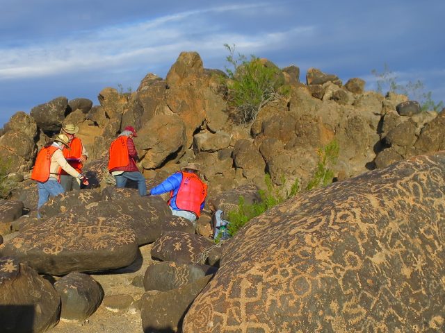 The Painted Rock team completing RASI on the boulders to analyze potential rock decay that puts the petroglyphs at risk.