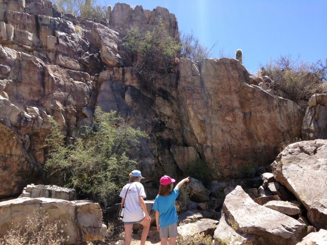 My daughters exploring a rock art site at Saguaro National Park, developing their own local sense of place.