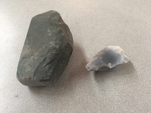 Tool kit used in the manufacture attempts. At left is a mudstone used for pecking the exterior. At right is the chalcedony biface used to peck and drill the chambers. Not pictured is the sandstone slab used to grind around the rim.