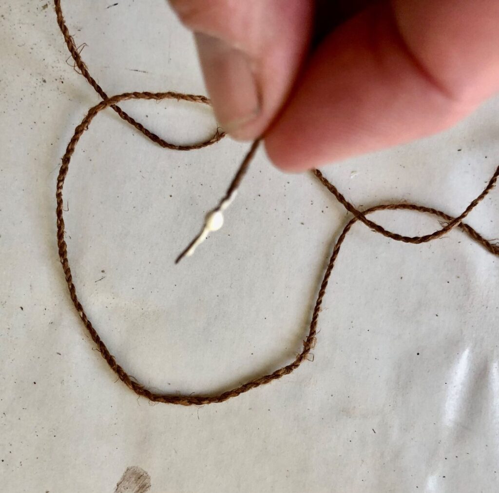 I used a bit of glue to stiffen the end of my cordage for stringing. I’m sure there were plenty of natural glues and stiffeners people used for such work in the past.
