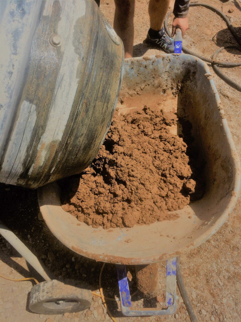 Dumping Mud into Wheelbarrow