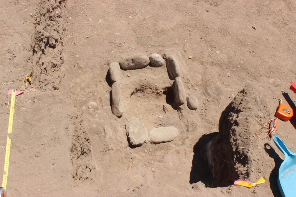 The hearth in Evan’s room is only the second complete hearth that we’ve found at the Gila River Farm site. It is lined with cobbles, and the cobbles on the southern side were pulled intentionally when the room was closed, or no longer used.