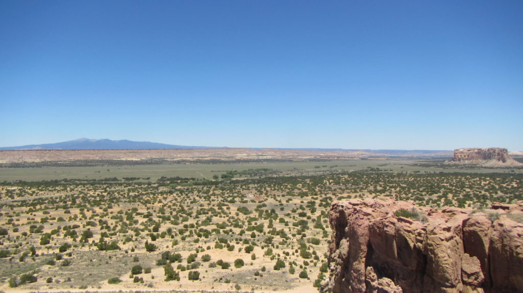 A view of the cultural landscape surrounding Acoma Pueblo Sky City. Enchanted Mesa is in the far right, and Mount Taylor is in the distance. Mount Taylor is a traditional cultural property, and like many peaks and ranges in the region, it is a sacred mountain to several tribes in the Southwest. Image: Karen Schollmeyer